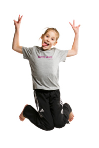 Young girl jumping wearing Skylark Sports t-shirt