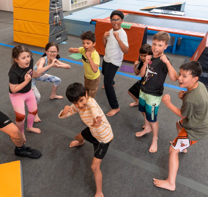 Kids learning ninja skills in a group class at Skylark Sports