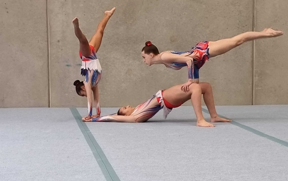 Acrobatic gymnastic floor exercise - Skylark Sports