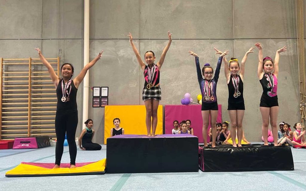 Gymnastics competition podium with medal winner