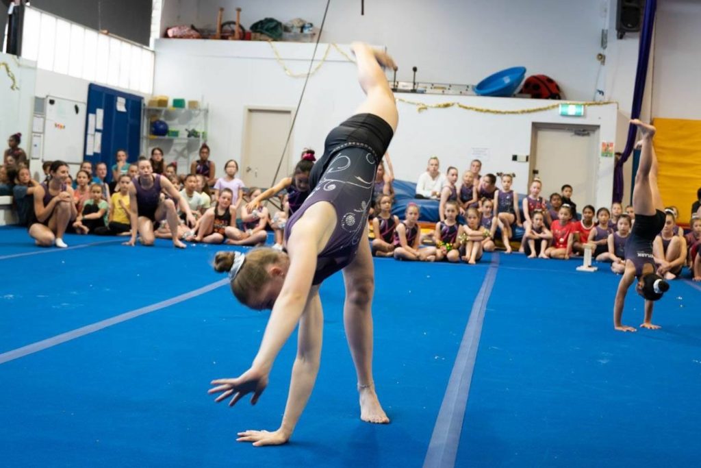 Kid Performing Cartwheel Floor Routine Skylark Sports