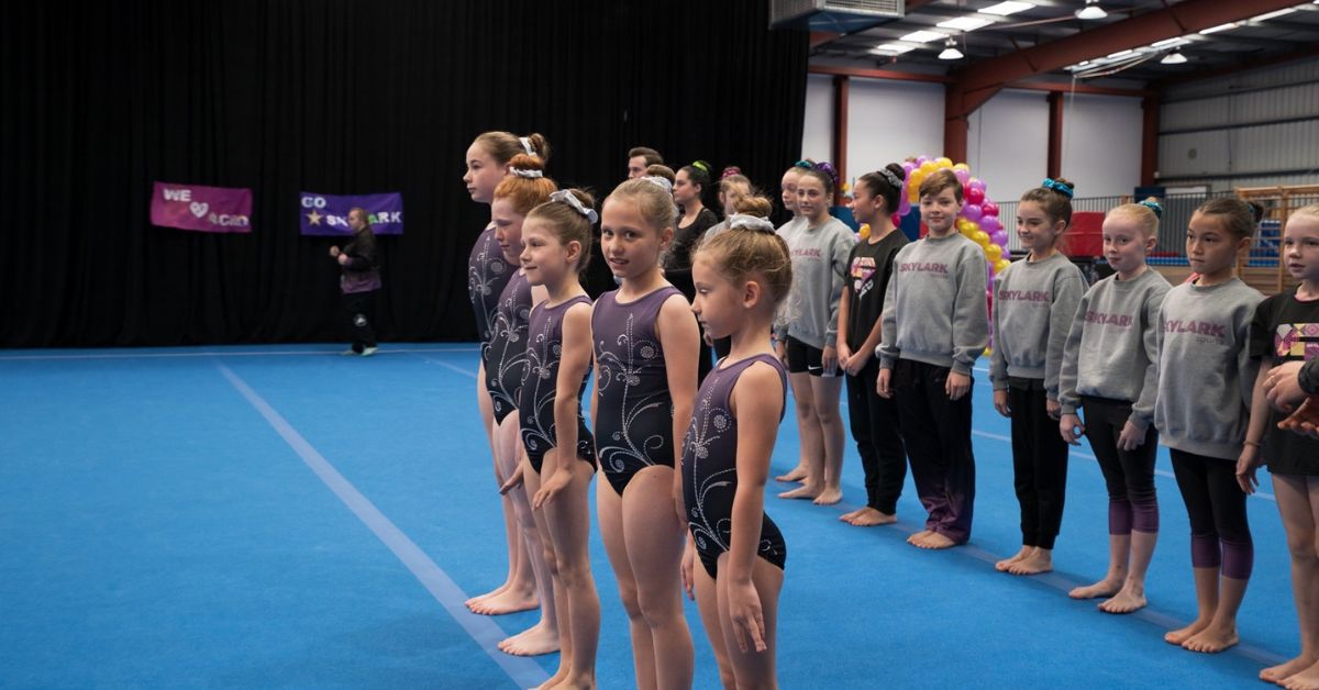 Kids line up for a gymnastic training
