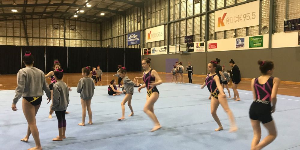 Ladies practicing gymnastic routine - Skylark Sports