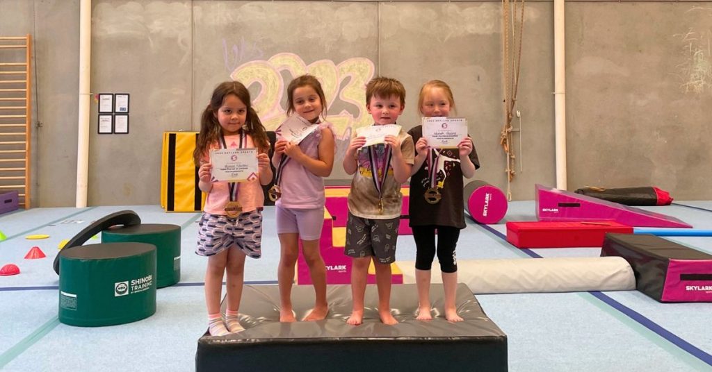 Kids holding certificates