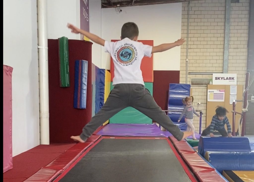 child star jumping on trampoline gymnastics